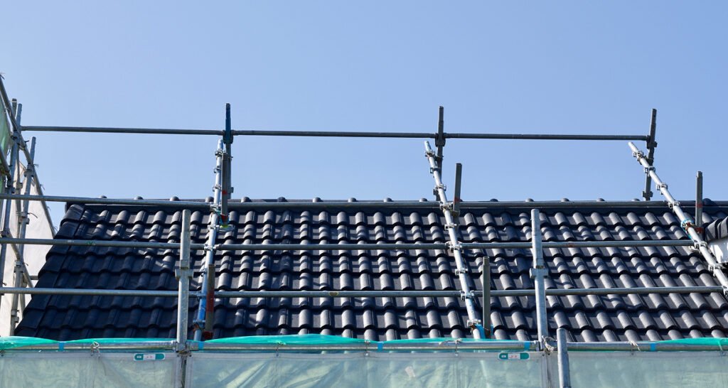 Tiled roof painting with scaffolding