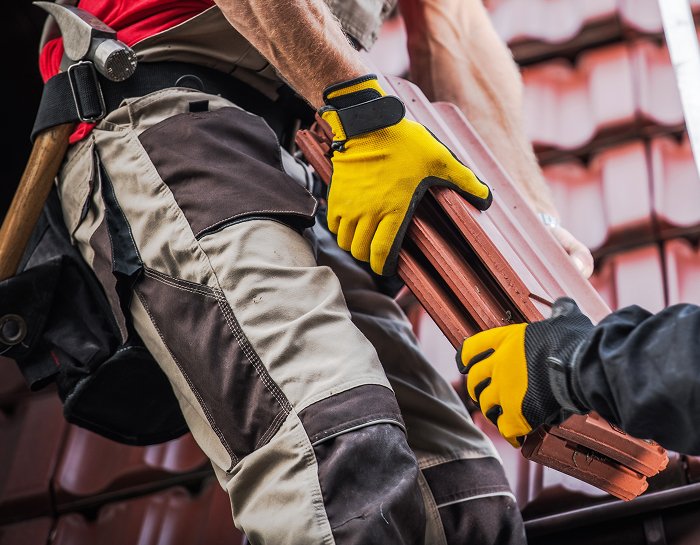 Local roof experts fixing tile roof